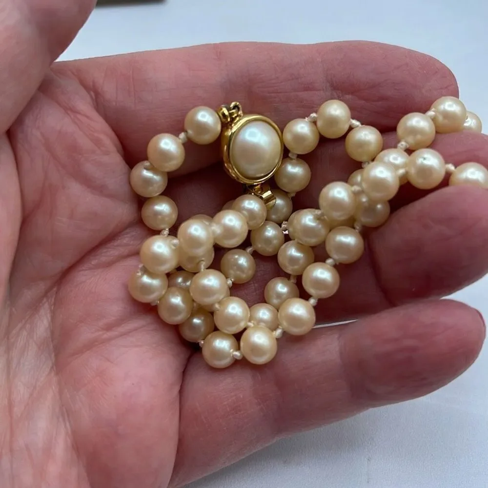 Vintage faux glass pearls. Hand knotted & 16”